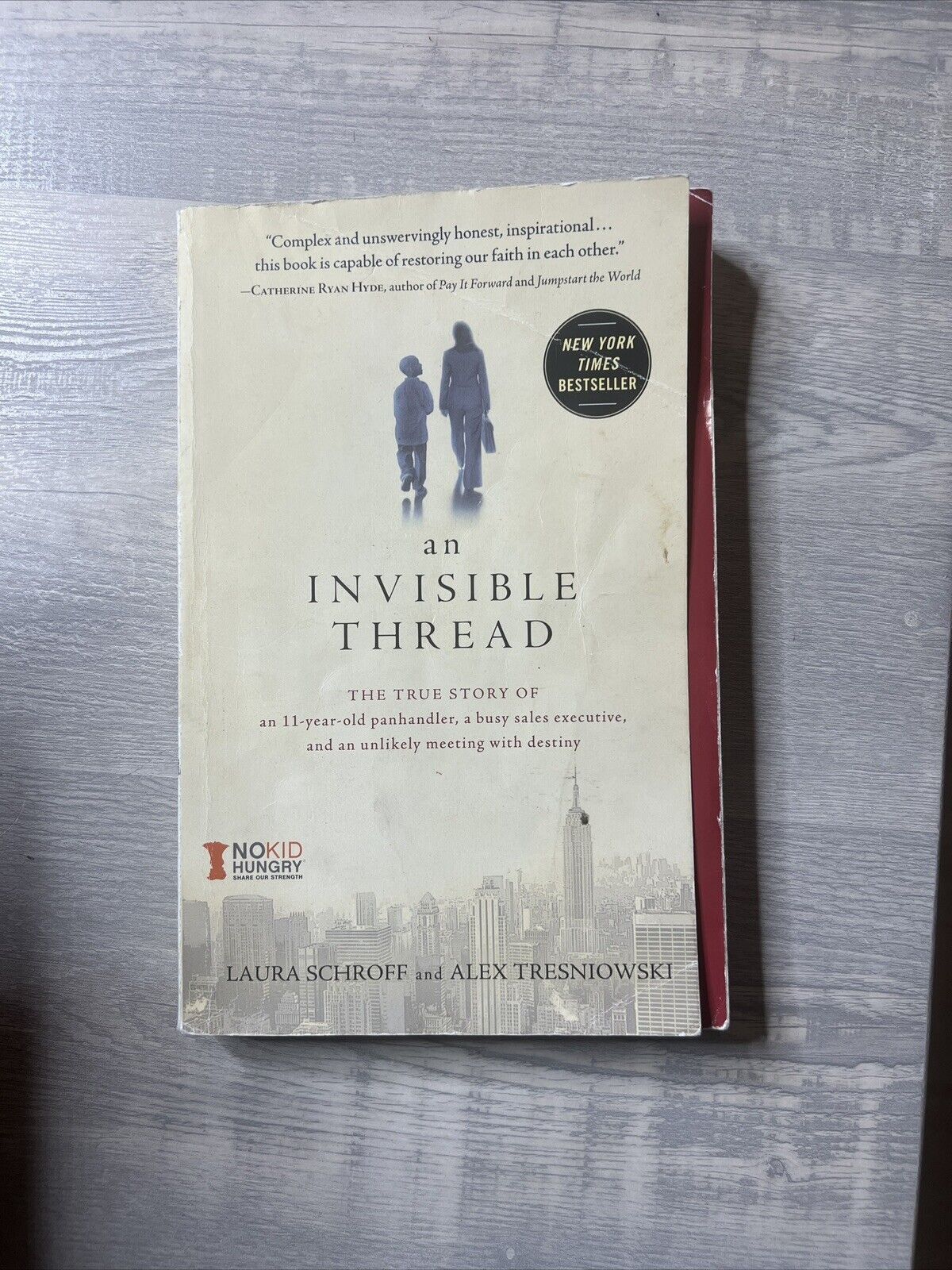 An Invisible Thread : The True Story of an 11-Year-Old Panhandler, a Busy Sales